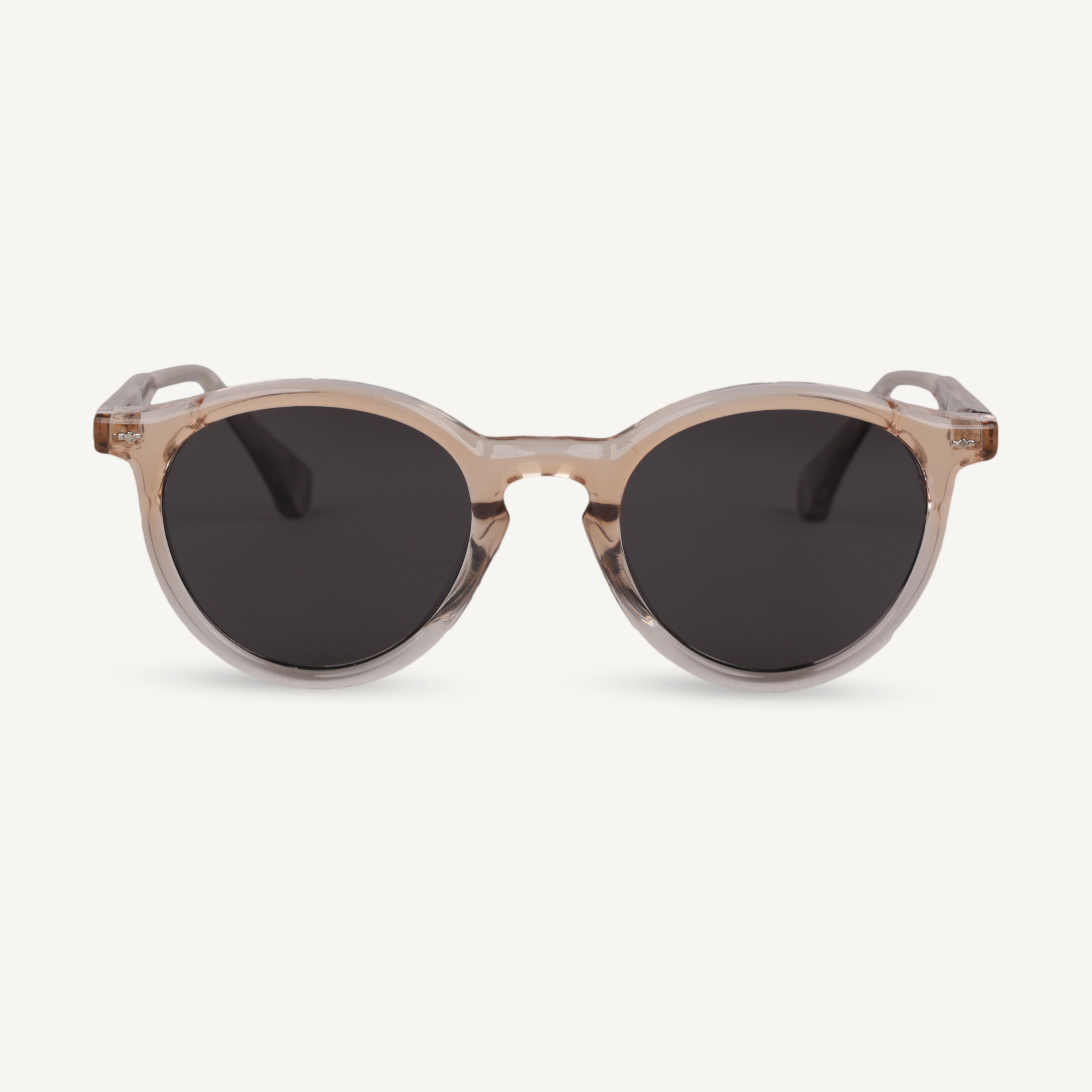 Sunglasses with round frame and dark lenses on a white background