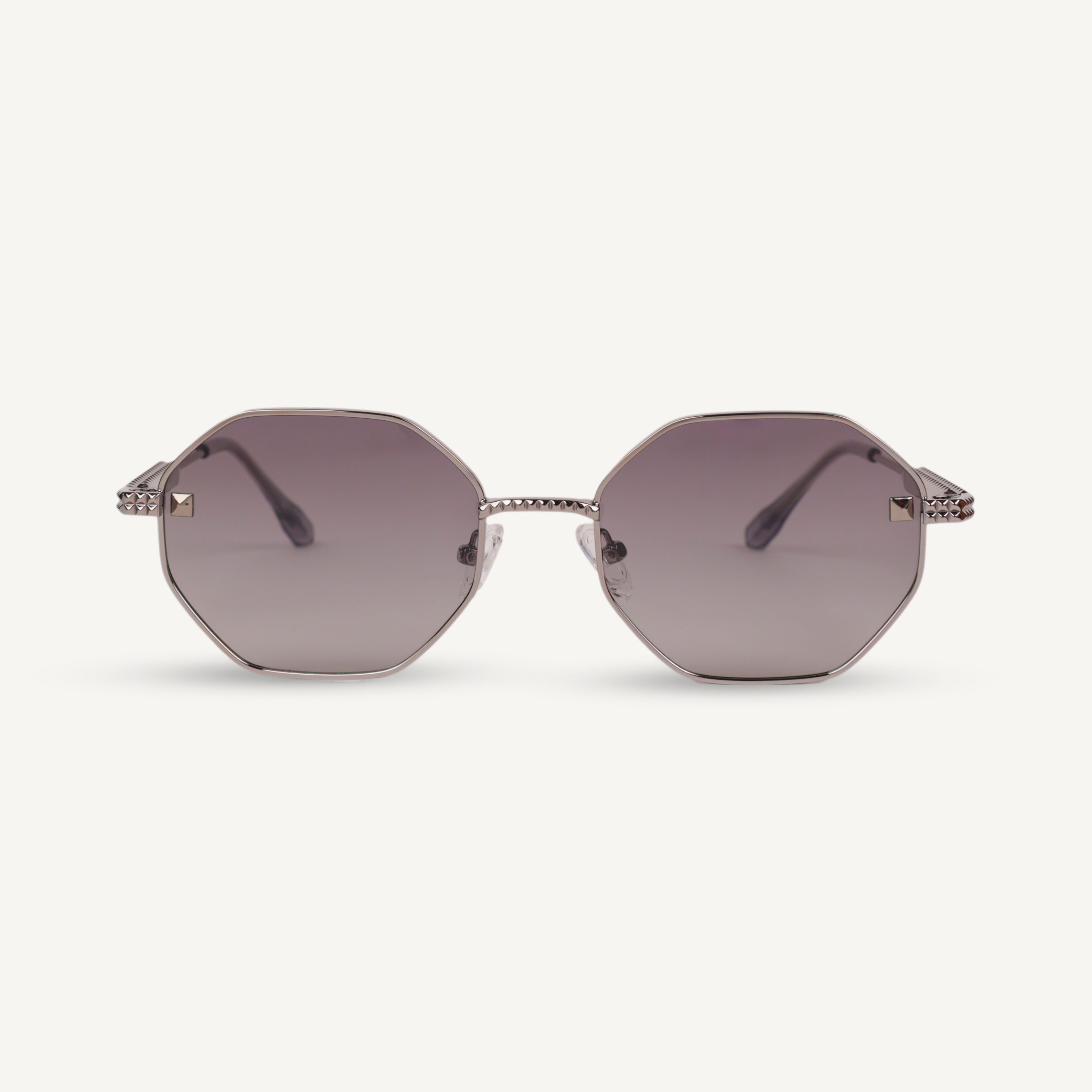 Octagonal sunglasses with a metallic frame on a white background