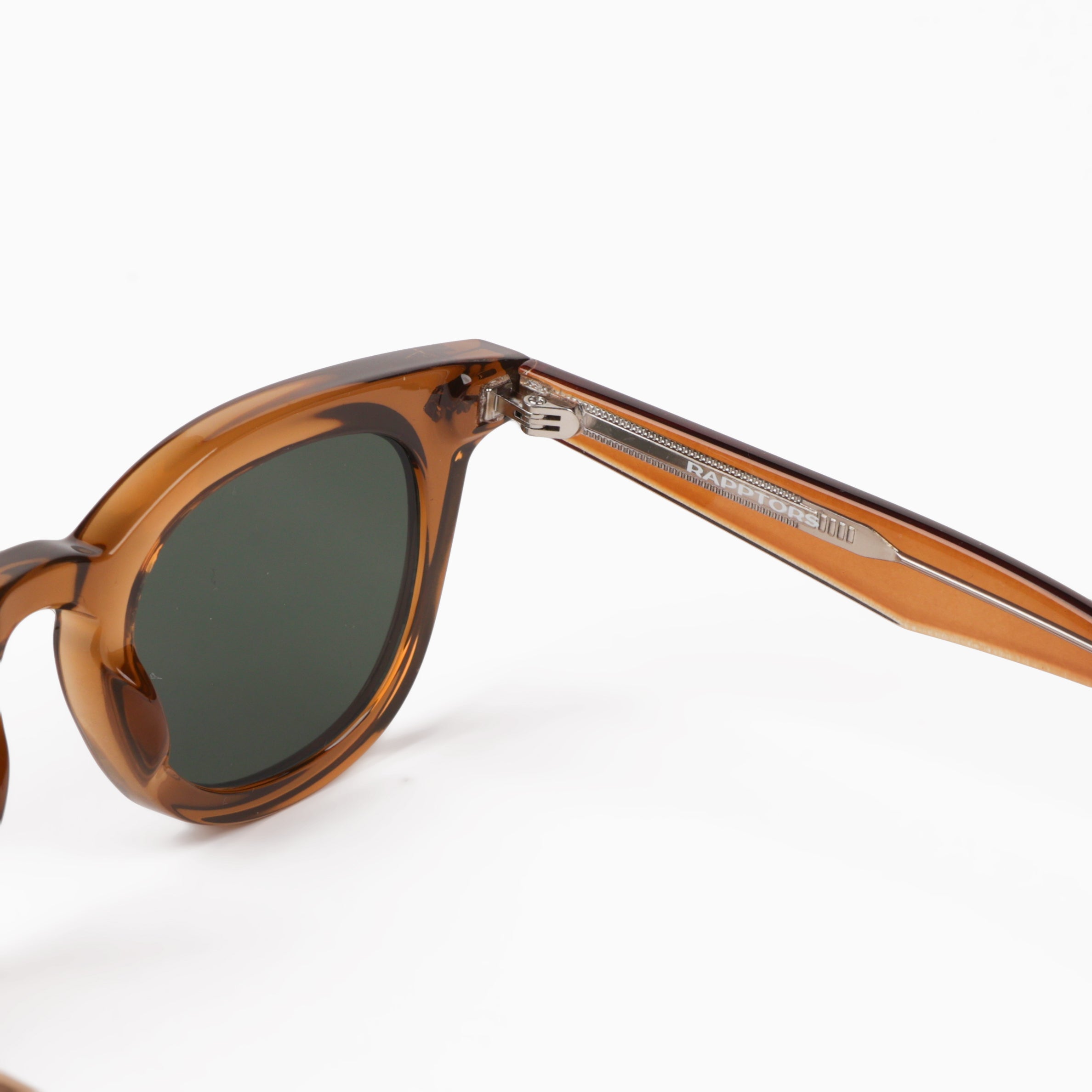 Brown sunglasses with a visible brand logo on a white background