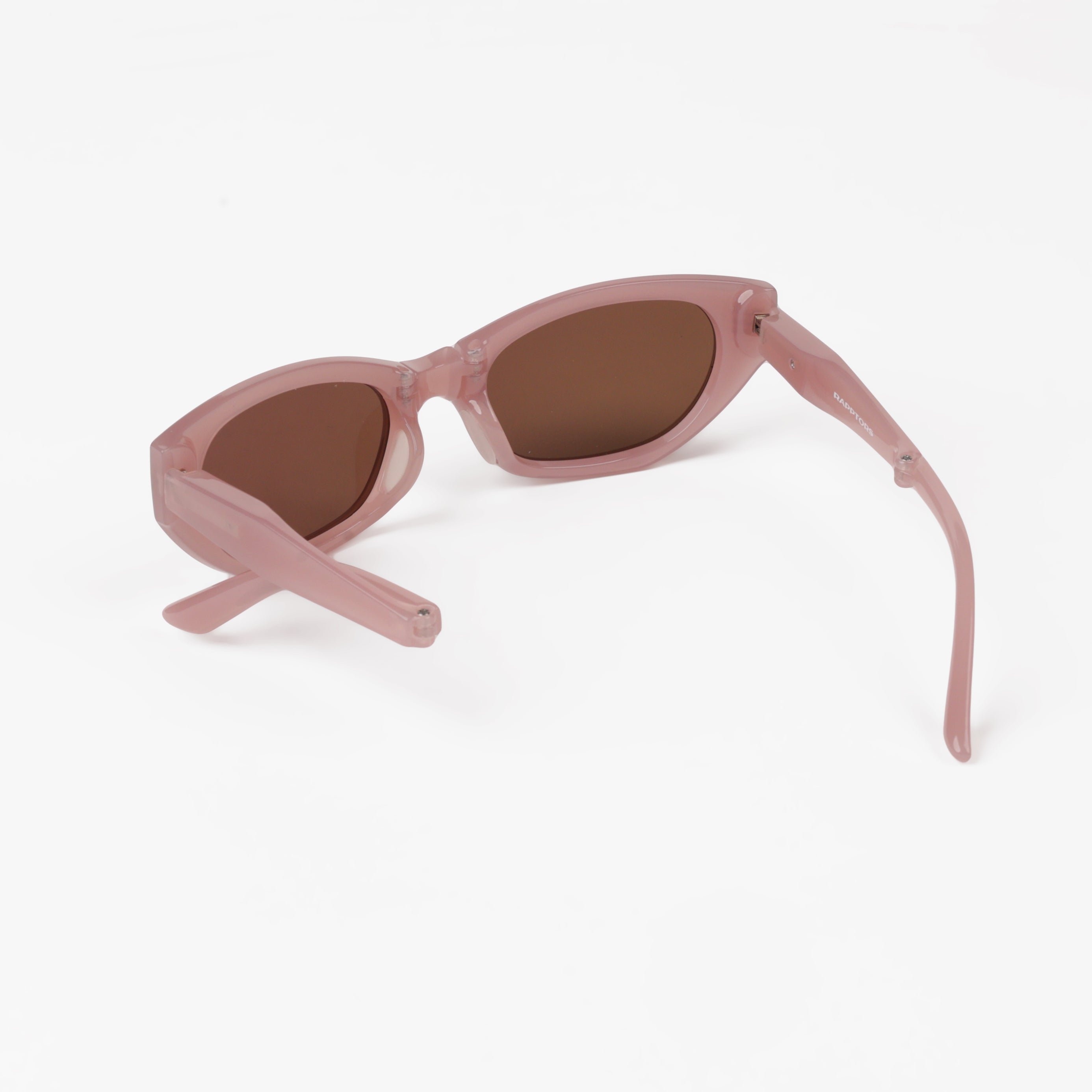 Pink sunglasses with brown lenses on a white background