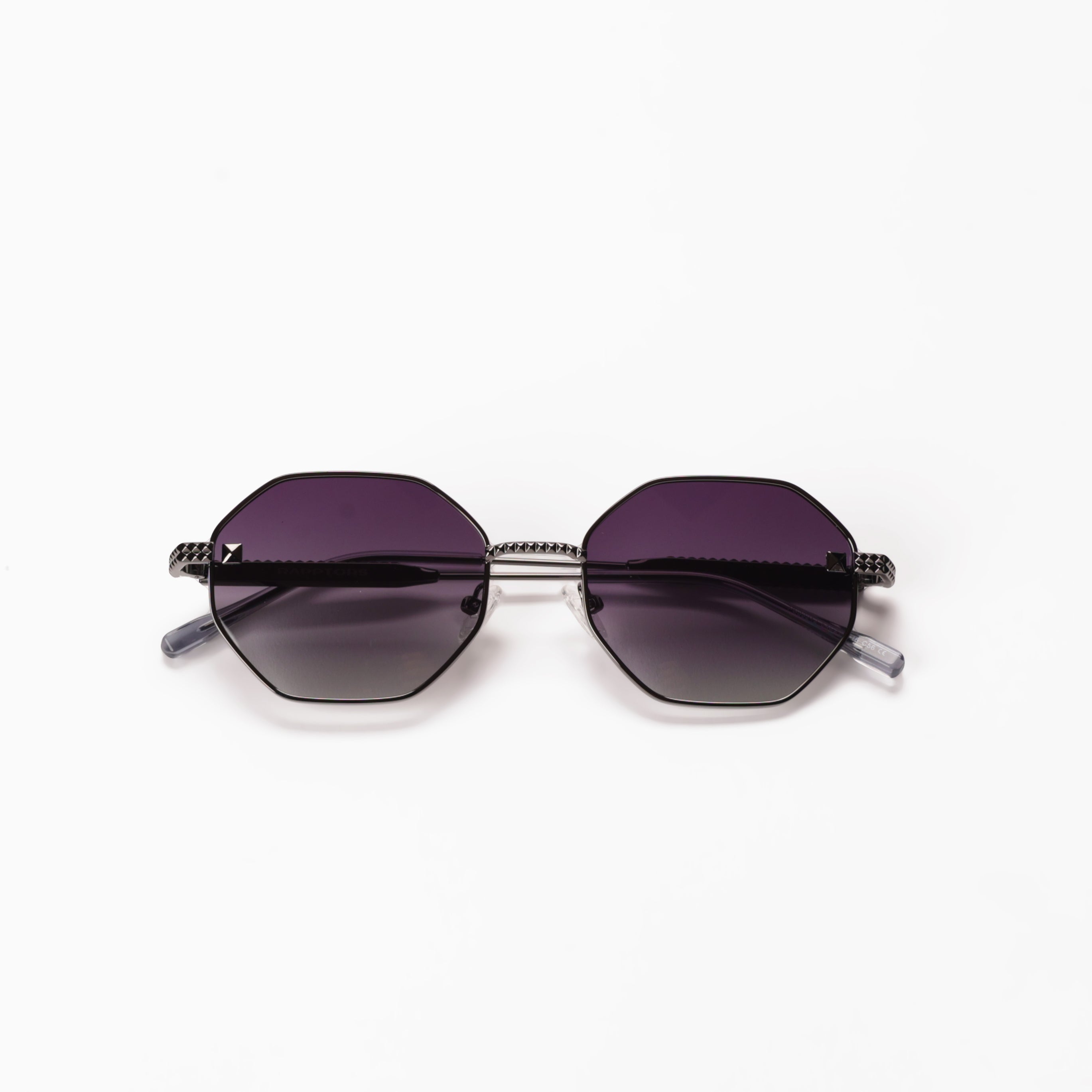 Sunglasses with purple lenses and black frames on a white background