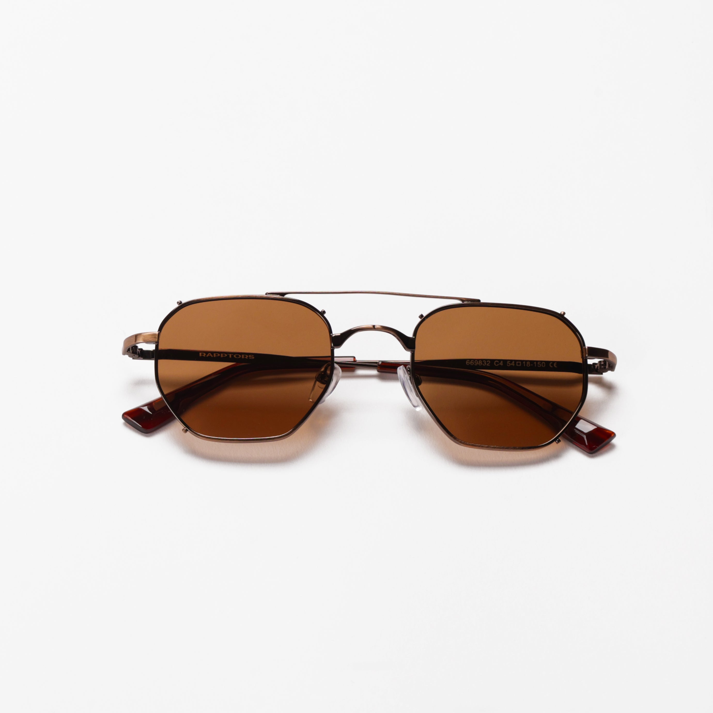 Sunglasses with brown lenses on a white background