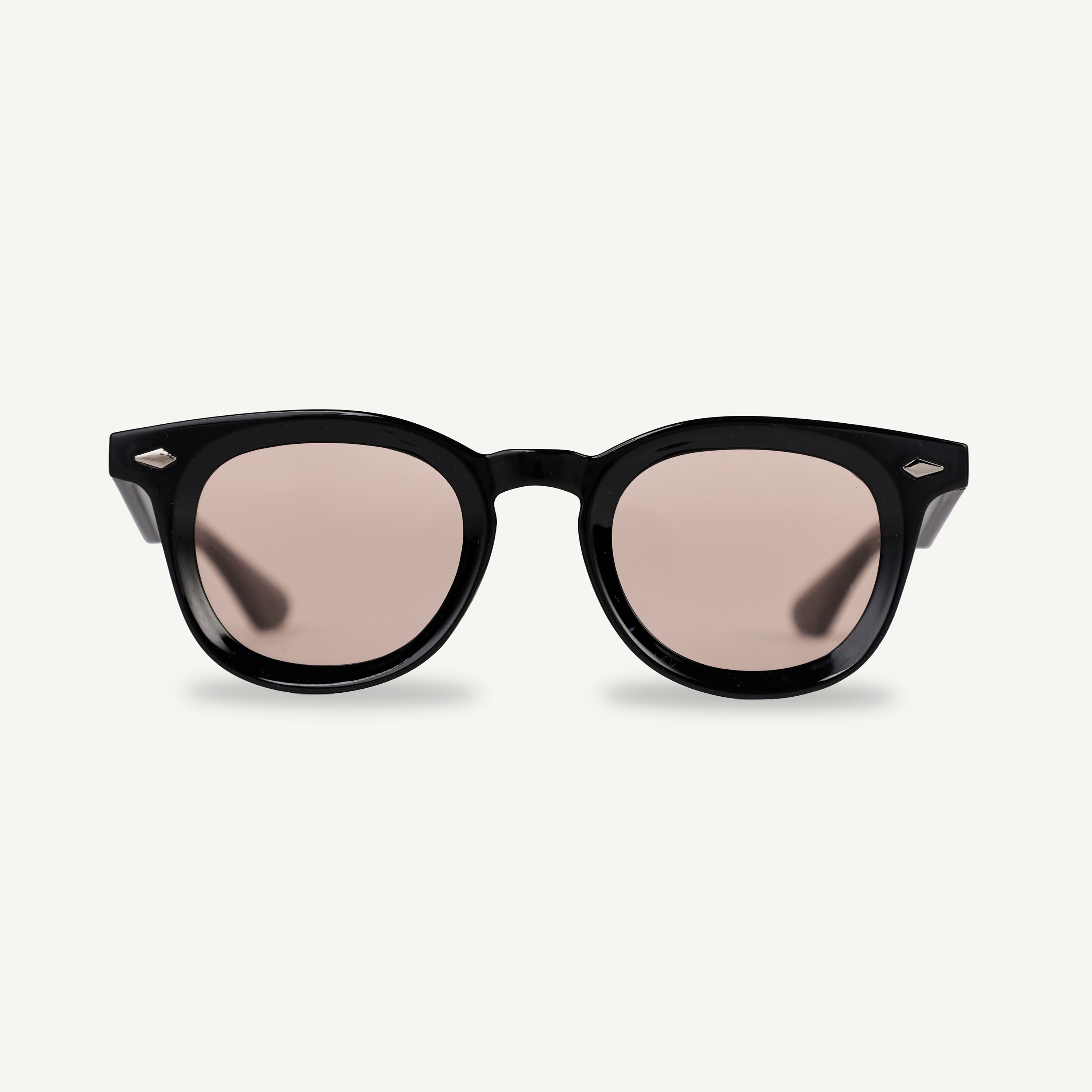 Black frame sunglasses with light brown lenses on a white background
